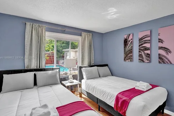 a bedroom with a large bed and a couch