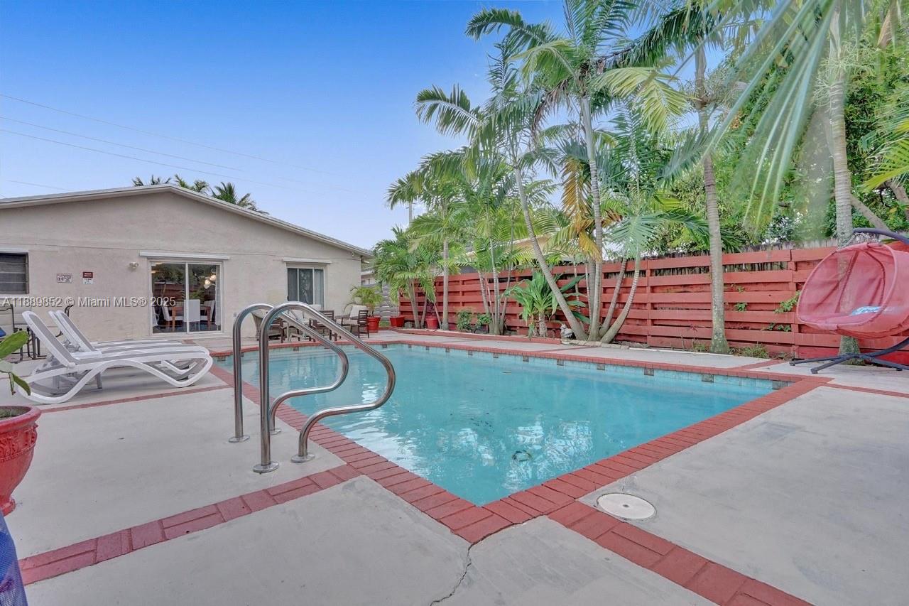 208 Southwest 2nd Avenue Hallandale Beach, FL 33009 - Photo 26 of 28 a view of a swimming pool with a patio
