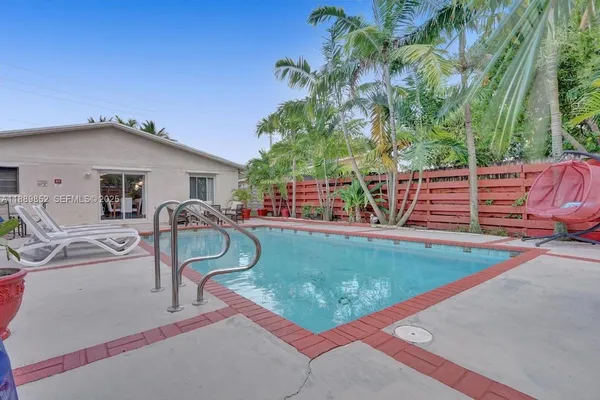 a view of a swimming pool with a patio