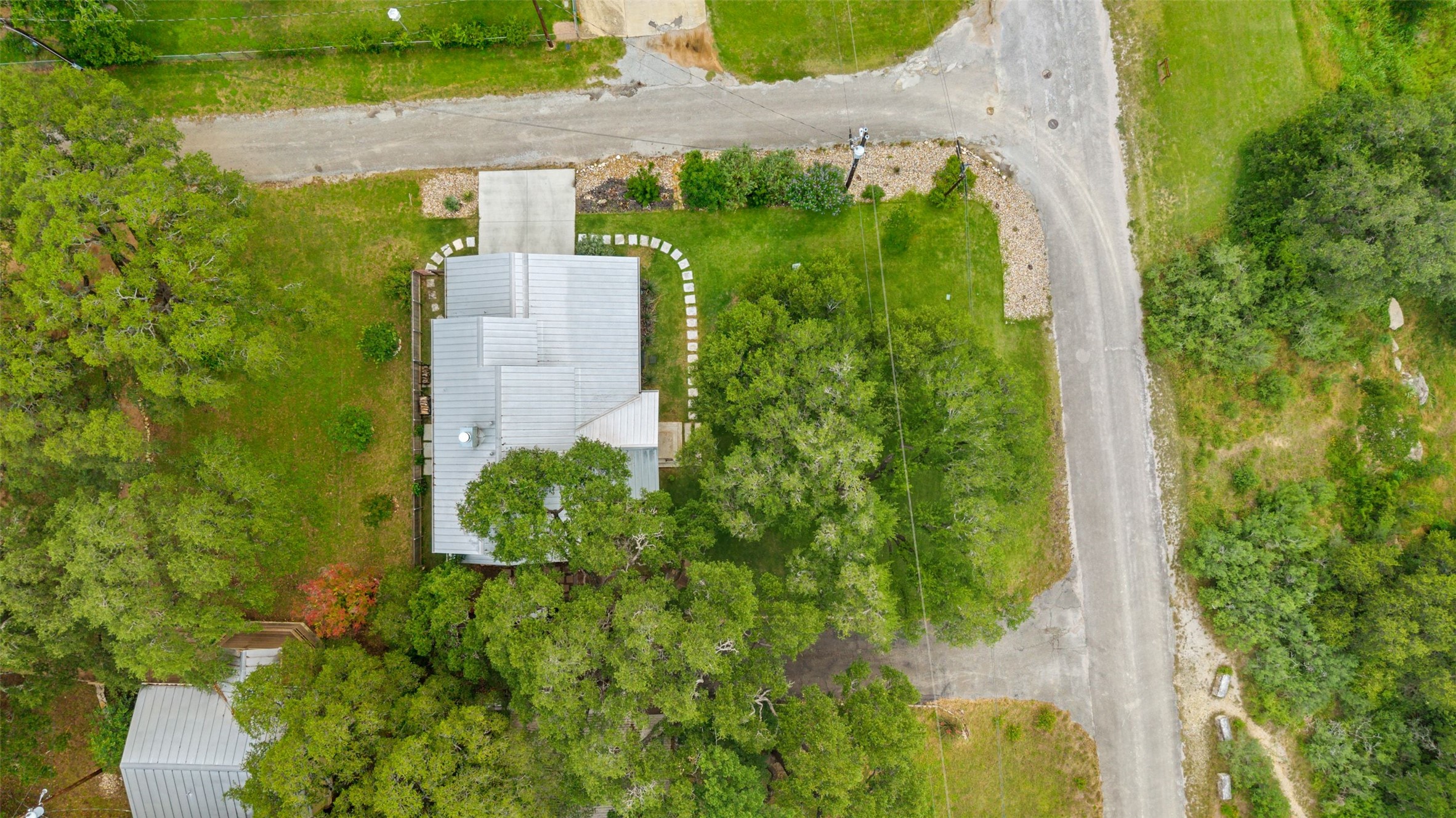 701 River Road Blanco, TX 78606 - Photo 37 of 38 an aerial view of a house with a yard