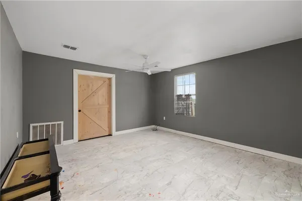 a view of an empty room and window