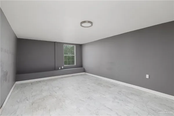 an empty room with windows