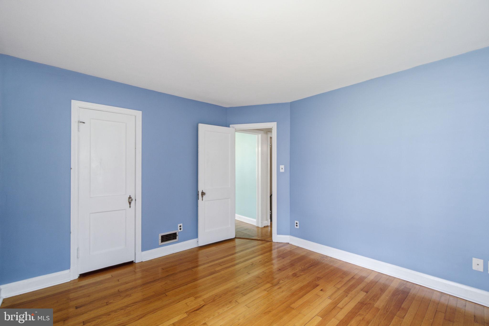 107 Oakway Road Lutherville-Timonium, MD 21093 - Photo 17 of 52 Main level bedroom with closet and hardwood floors