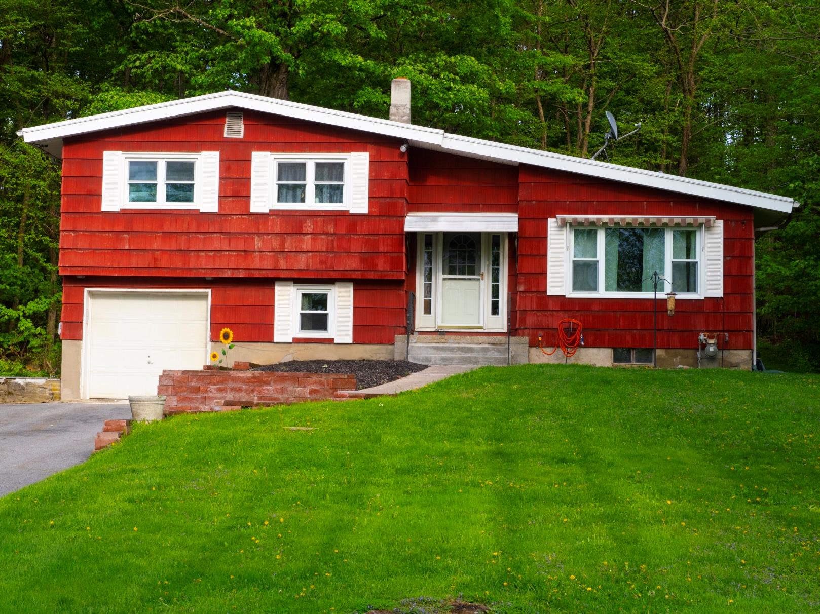 44 Old Rte 208 Montgomery, NY 12549 - Photo 1 of 1 Split level home featuring a garage, a front yard, and aphalt driveway