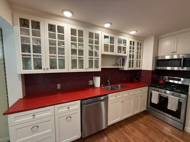 720 South New Street Champaign, IL 61820 - Photo 17 of 73 a kitchen with stainless steel appliances granite countertop a stove a sink and a microwave