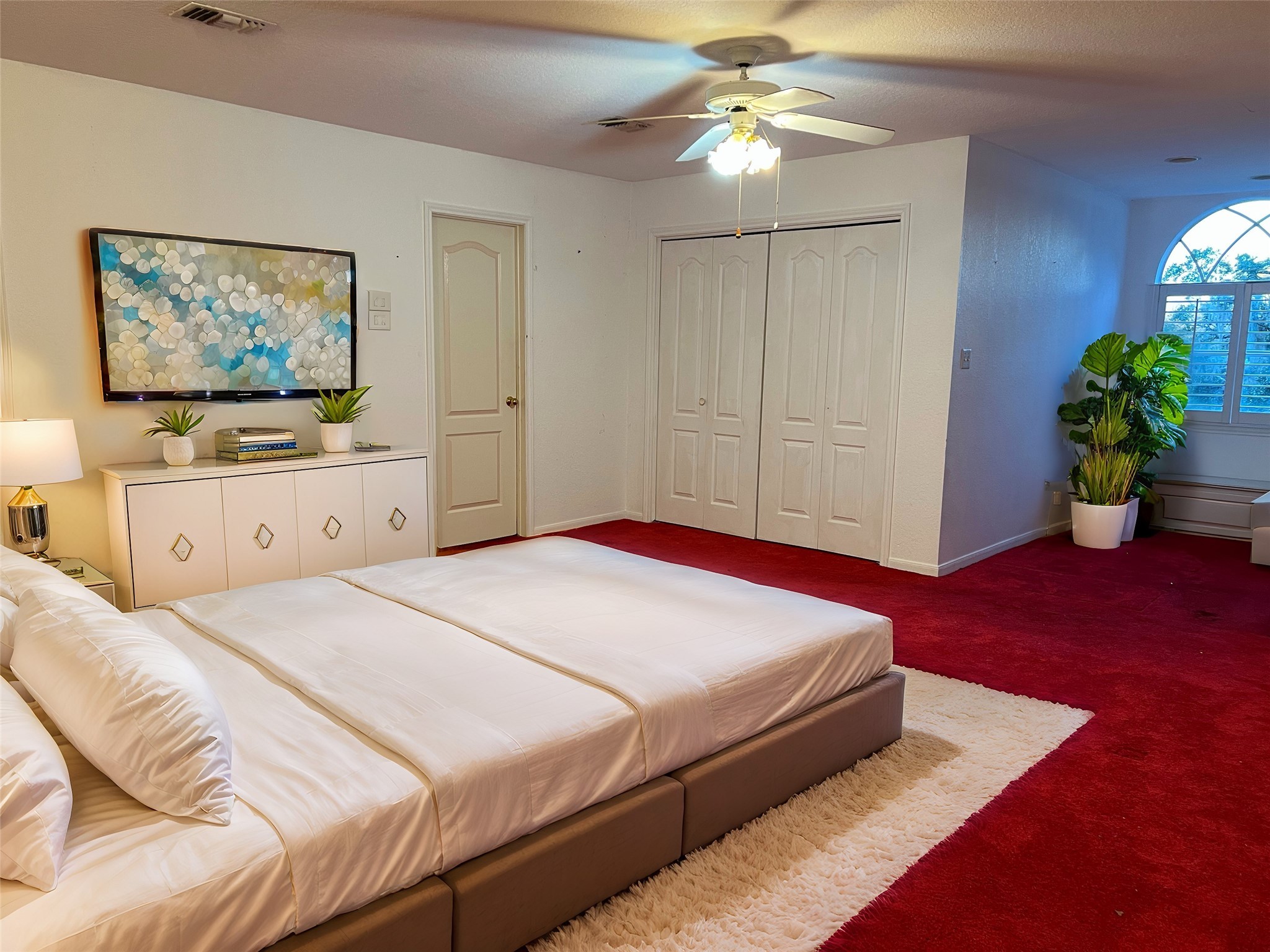 7850 County Road 684 Sweeny, TX 77480 - Photo 7 of 10 a bedroom with a bed and a chandelier