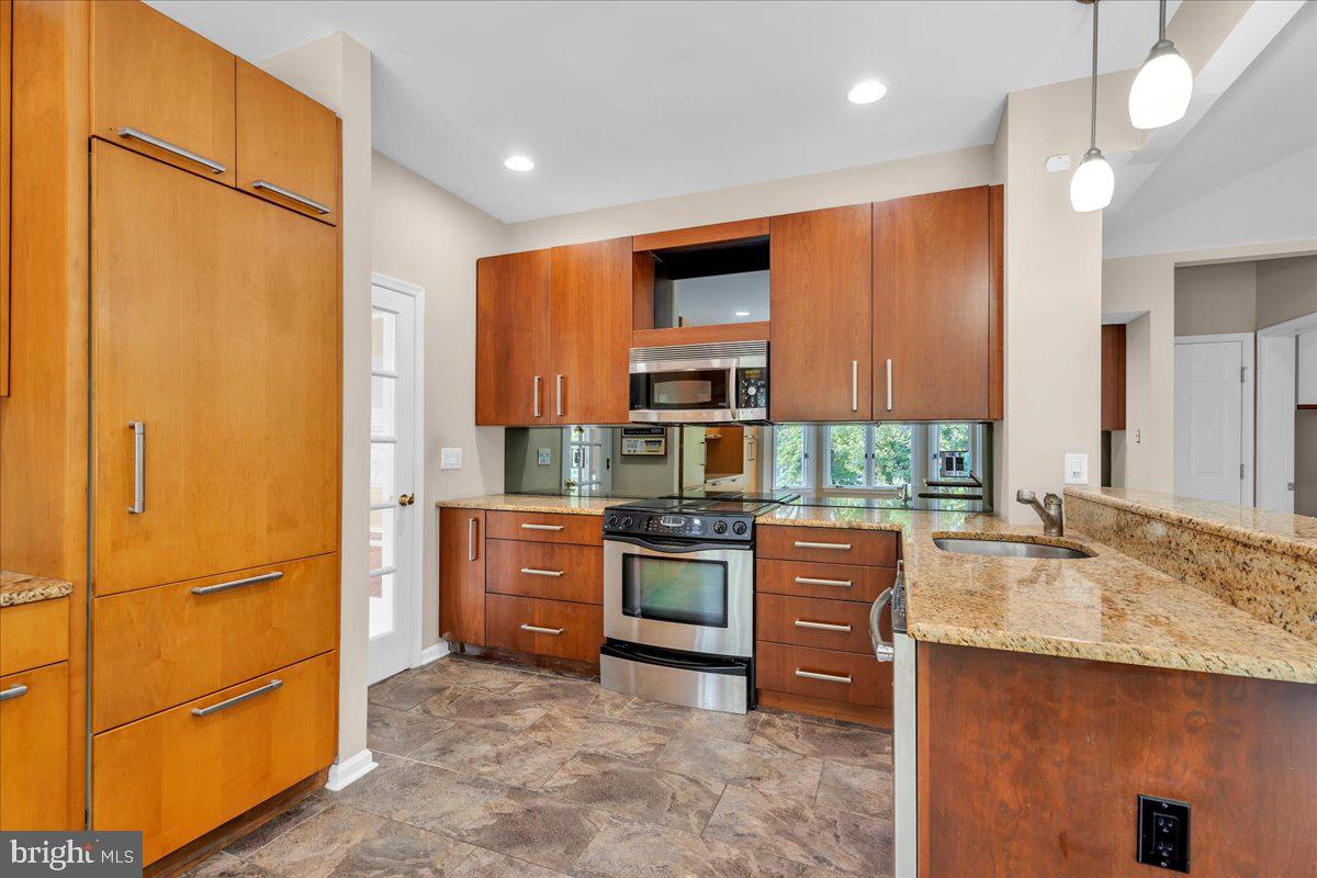 5 Promenade Place Voorhees, NJ 08043 - Photo 11 of 24 a kitchen with stainless steel appliances granite countertop a refrigerator a stove and a sink