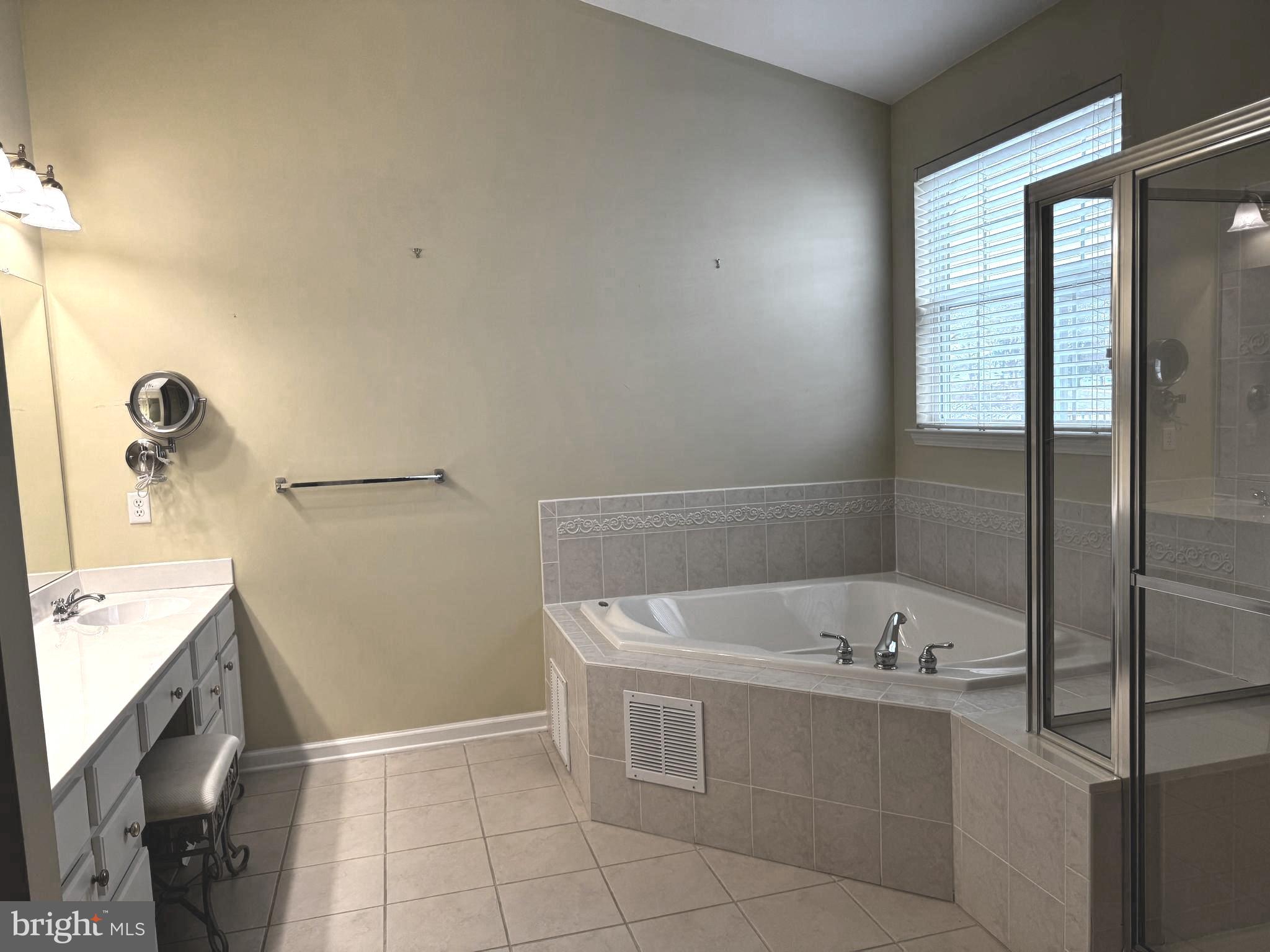 10 Powderhorn Way Allentown, NJ 08501 - Photo 17 of 42 a bathroom with a bathtub sink and mirror