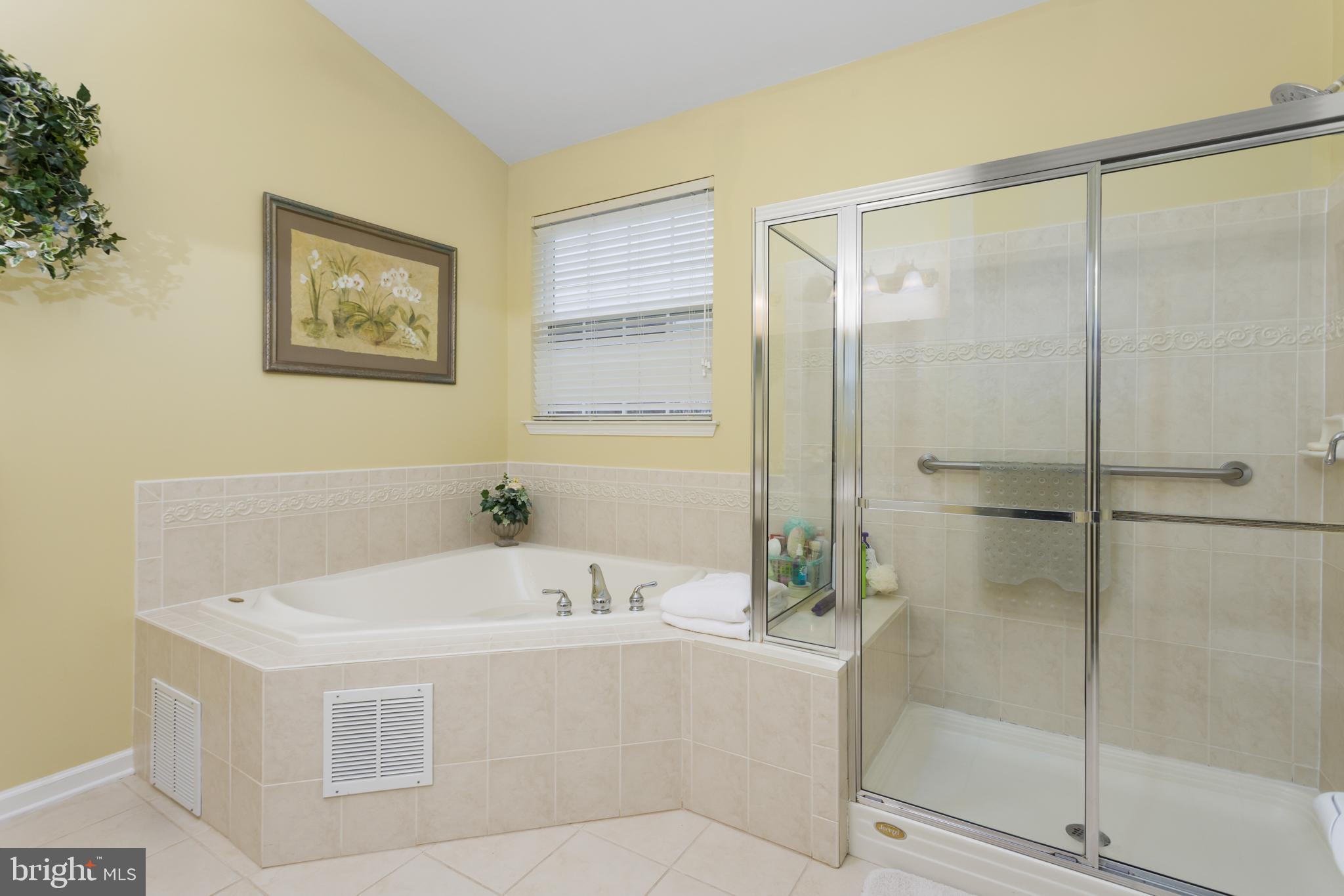 10 Powderhorn Way Allentown, NJ 08501 - Photo 18 of 42 a bathroom with a bathtub and a shower