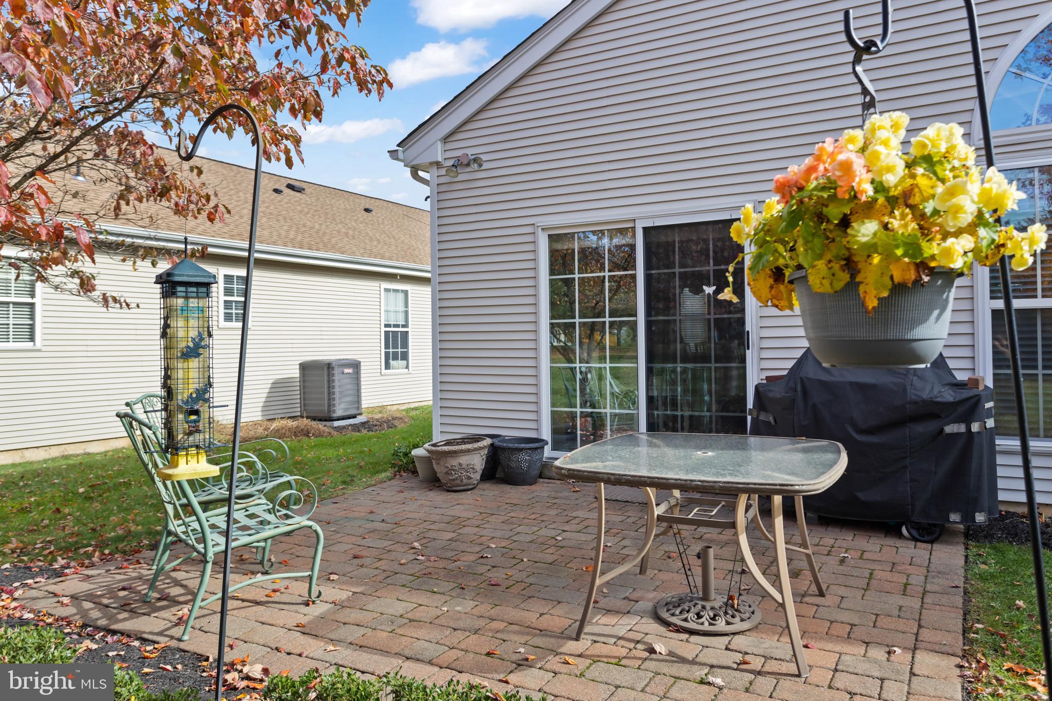 10 Powderhorn Way Allentown, NJ 08501 - Photo 27 of 44 a backyard of a house with table and chairs
