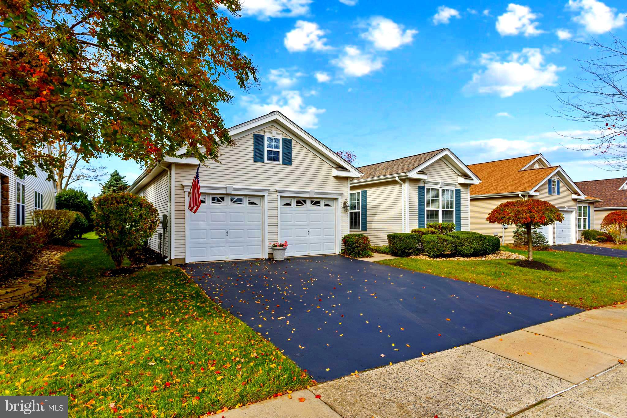 10 Powderhorn Way Allentown, NJ 08501 - Photo 4 of 44 a view of a white house with a yard and plants