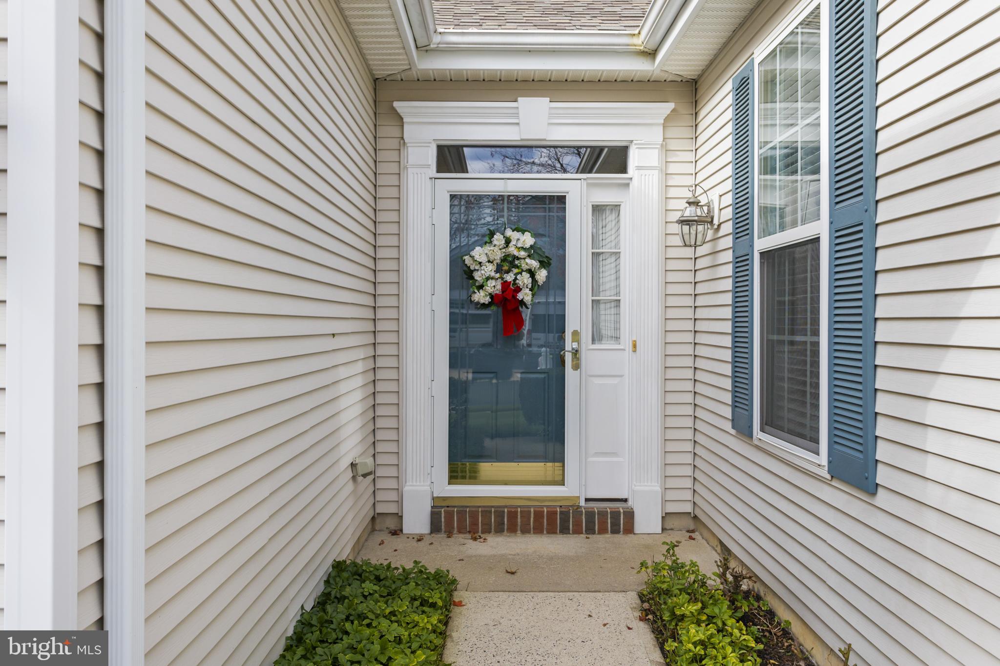 10 Powderhorn Way Allentown, NJ 08501 - Photo 5 of 44 a view of a door of the house with a potted plant