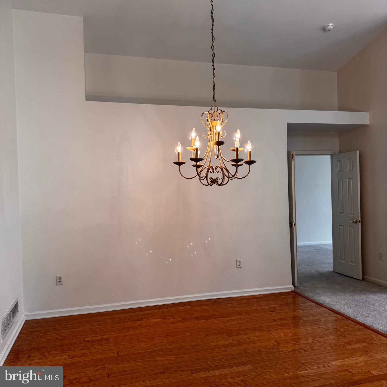 10 Powderhorn Way Allentown, NJ 08501 - Photo 10 of 42 a view of a room with wooden floor and chandelier