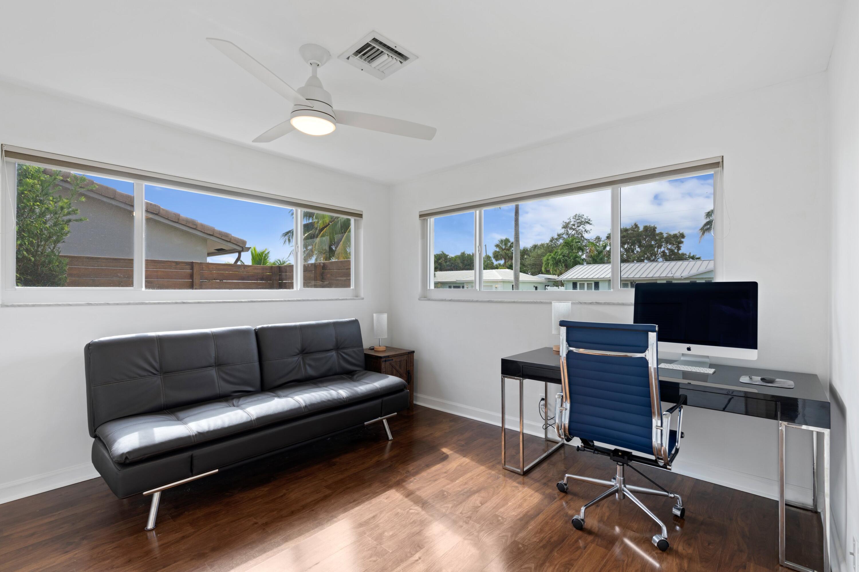 1093 Southwest 14th Street Boca Raton, FL 33486 - Photo 11 of 18 a living room with furniture and a flat screen tv