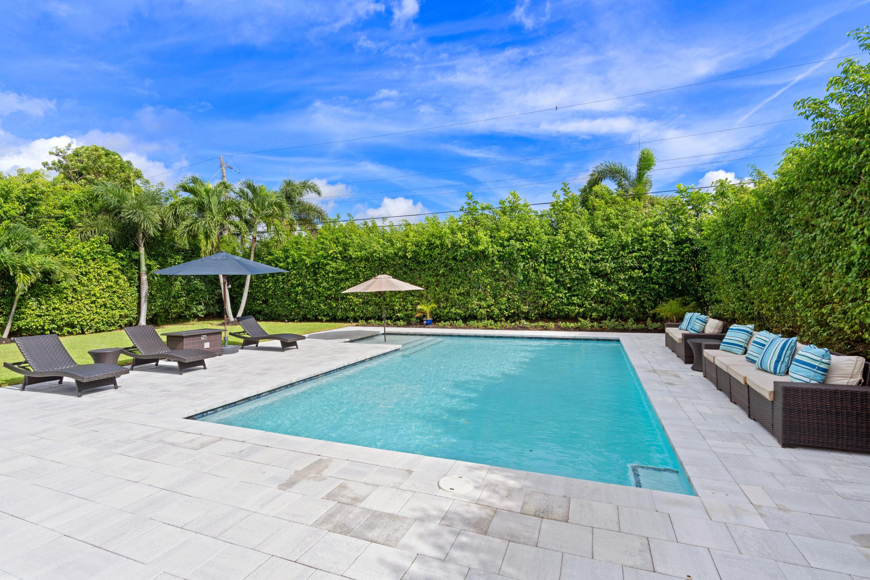 1093 Southwest 14th Street Boca Raton, FL 33486 - Photo 15 of 18 a view of a swimming pool with sitting area
