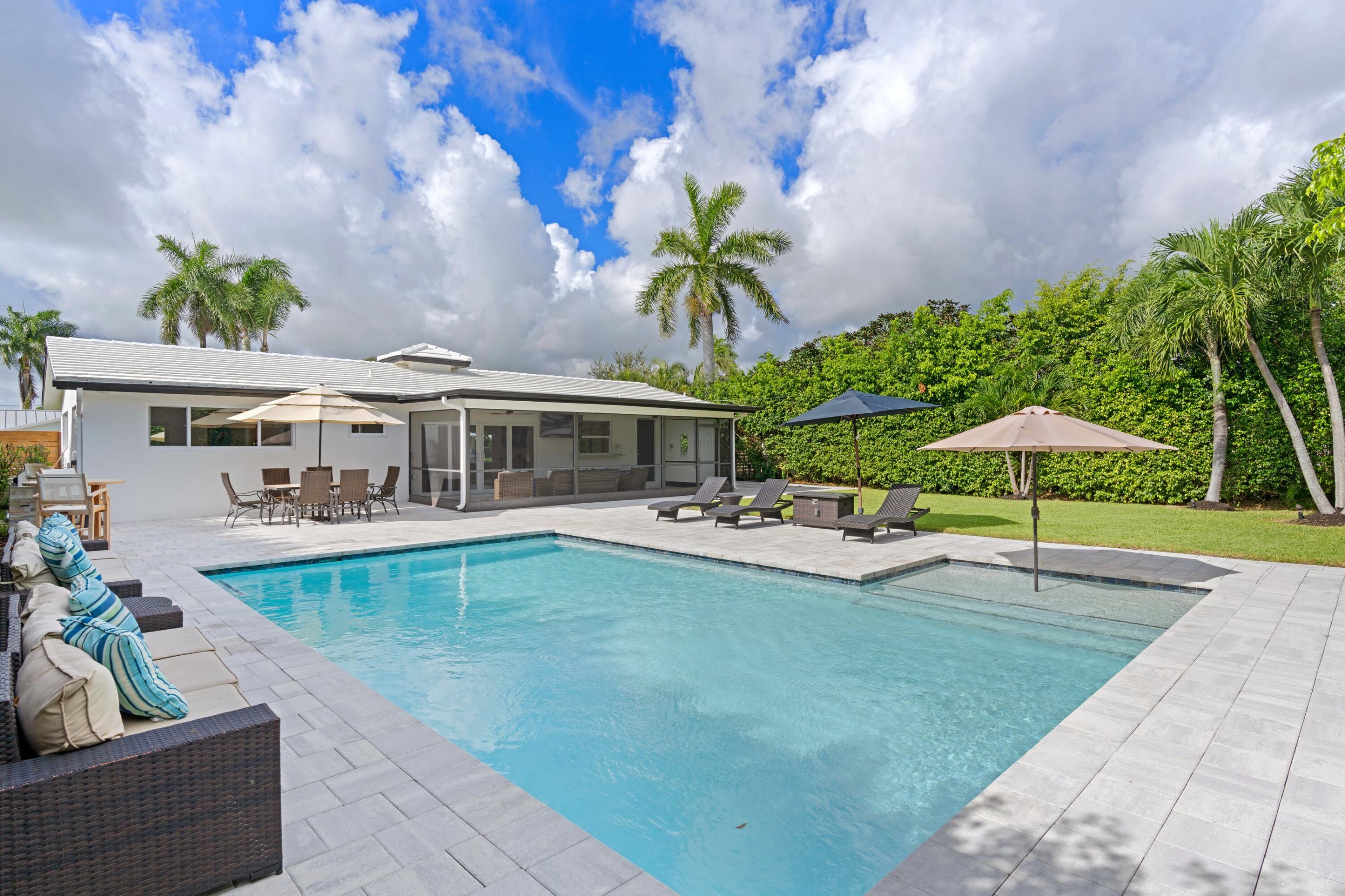 1093 Southwest 14th Street Boca Raton, FL 33486 - Photo 3 of 18 a view of a house with swimming pool