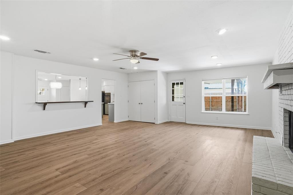 1236 Terrace Drive Grapevine, TX 76051 - Photo 11 of 25 an empty room with wooden floor and windows