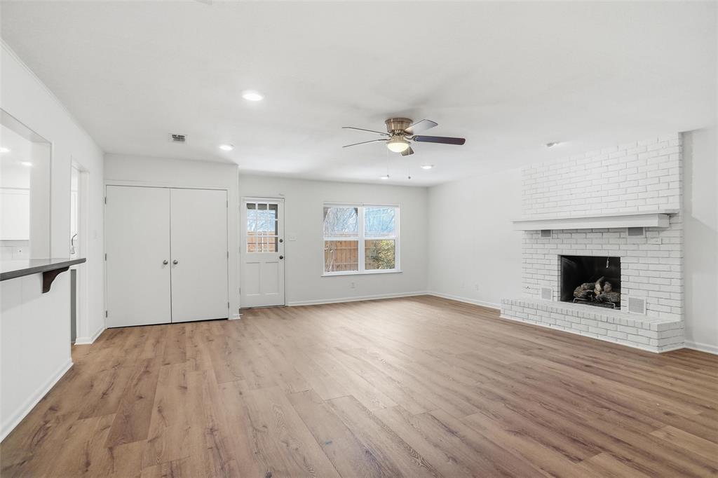 1236 Terrace Drive Grapevine, TX 76051 - Photo 12 of 25 a view of an empty room with a fireplace and a window