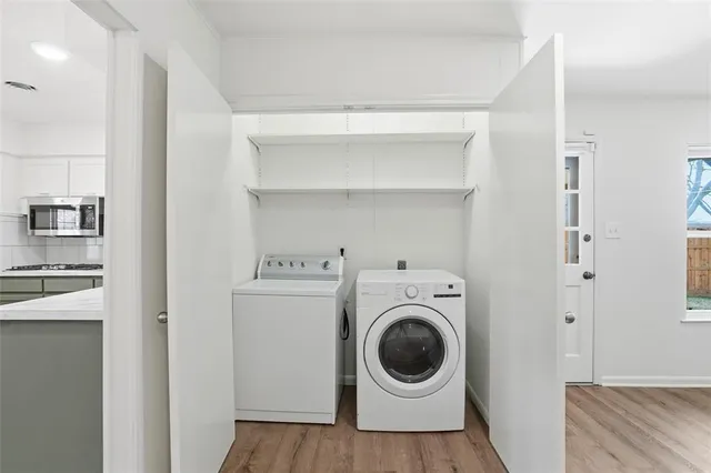 a view of a storage & utility room with washer and dryer
