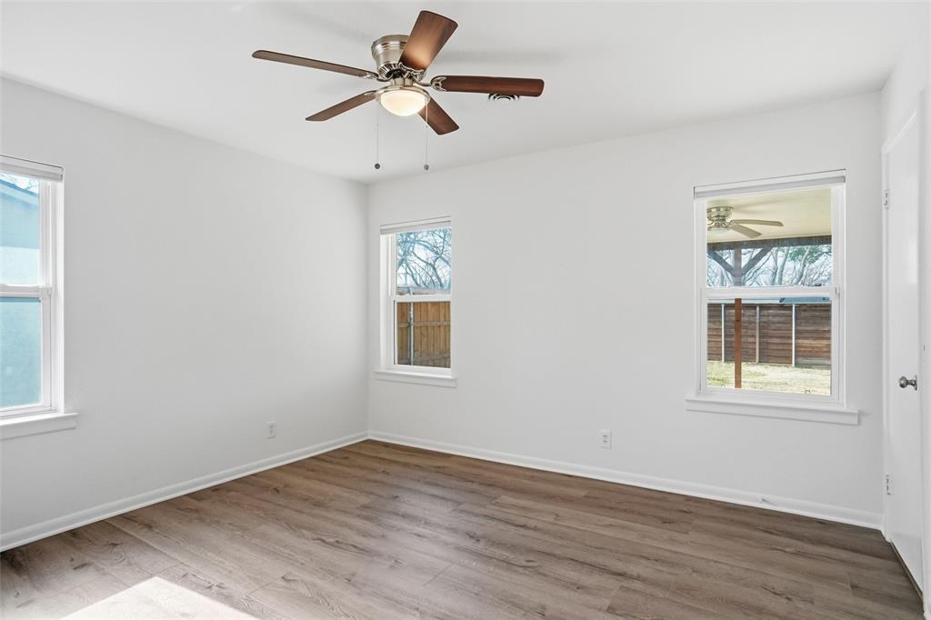 1236 Terrace Drive Grapevine, TX 76051 - Photo 14 of 25 a view of empty room with wooden floor and fan