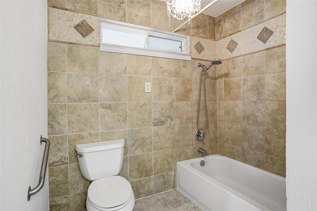 1236 Terrace Drive Grapevine, TX 76051 - Photo 17 of 25 a bathroom with a toilet and a shower