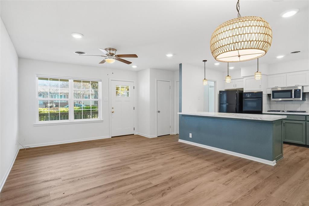1236 Terrace Drive Grapevine, TX 76051 - Photo 3 of 25 an empty room with wooden floor and windows