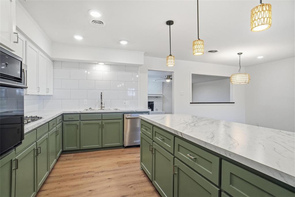1236 Terrace Drive Grapevine, TX 76051 - Photo 8 of 25 a kitchen with sink cabinets and window