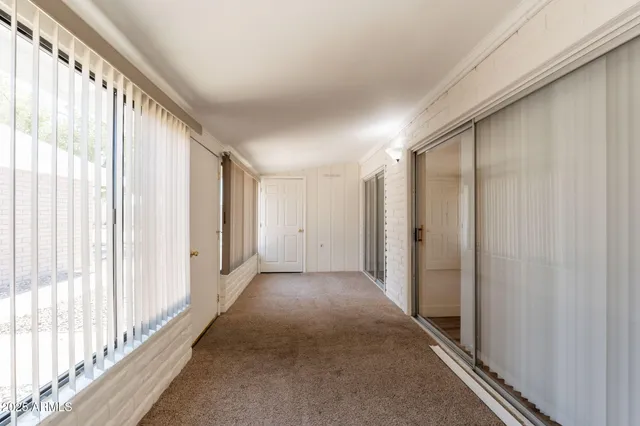 a view of a hallway with a large window