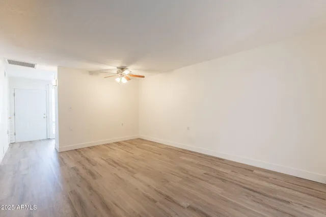 a view of a big room with wooden floor