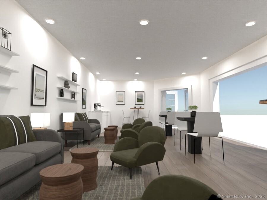 5 Cherry Brook Road, Unit 121 Canton, CT 06019 - Photo 6 of 10 a living room with furniture a wooden floor and a chandelier