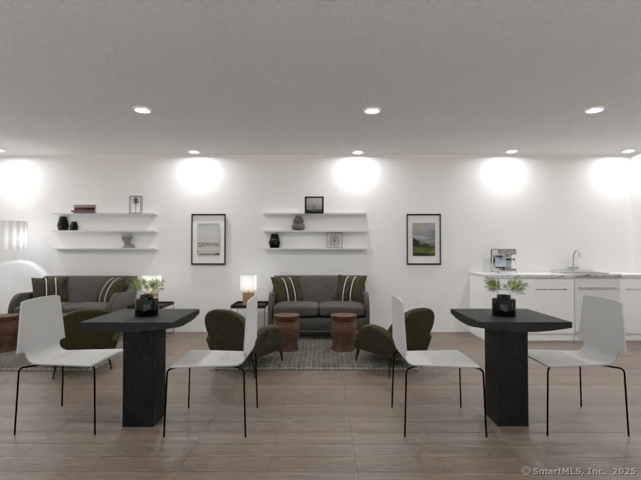 5 Cherry Brook Road, Unit 121 Canton, CT 06019 - Photo 10 of 10 a living room with furniture a rug and a fireplace