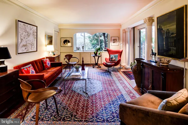 a very nice looking room with a large window and mirror