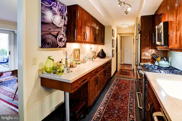 a bathroom with double vanity and a bathtub