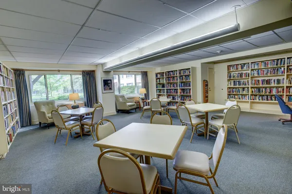 a view of a lobby with furniture and floor to ceiling window
