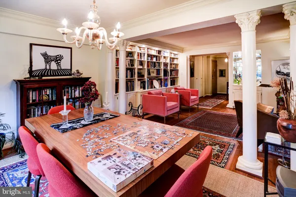a living room with furniture rug and wooden floor