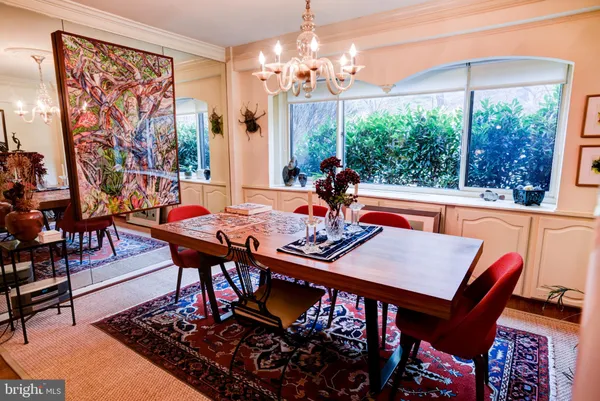 a living room with furniture rug and window