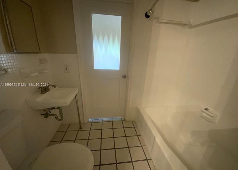 4308 Adams Street Hollywood, FL 33021 - Photo 16 of 21 a bathroom with a sink and a window