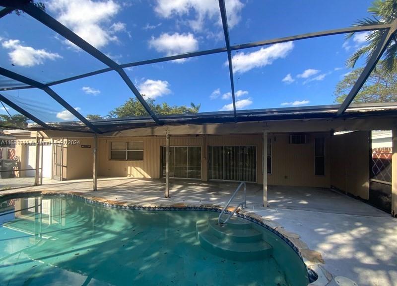 4308 Adams Street Hollywood, FL 33021 - Photo 20 of 21 a view of a house with a porch and furniture