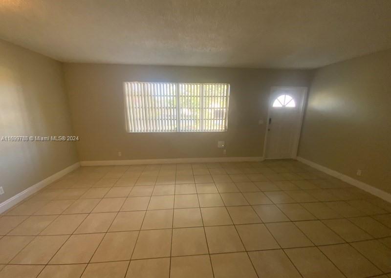 4308 Adams Street Hollywood, FL 33021 - Photo 2 of 21 a view of an empty room and window