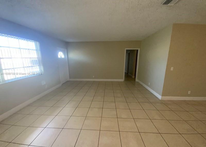 4308 Adams Street Hollywood, FL 33021 - Photo 3 of 21 a view of an empty room and window