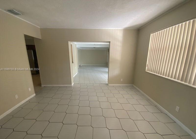 4308 Adams Street Hollywood, FL 33021 - Photo 5 of 21 a view of an empty room and window
