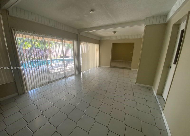 4308 Adams Street Hollywood, FL 33021 - Photo 8 of 21 an empty room with windows