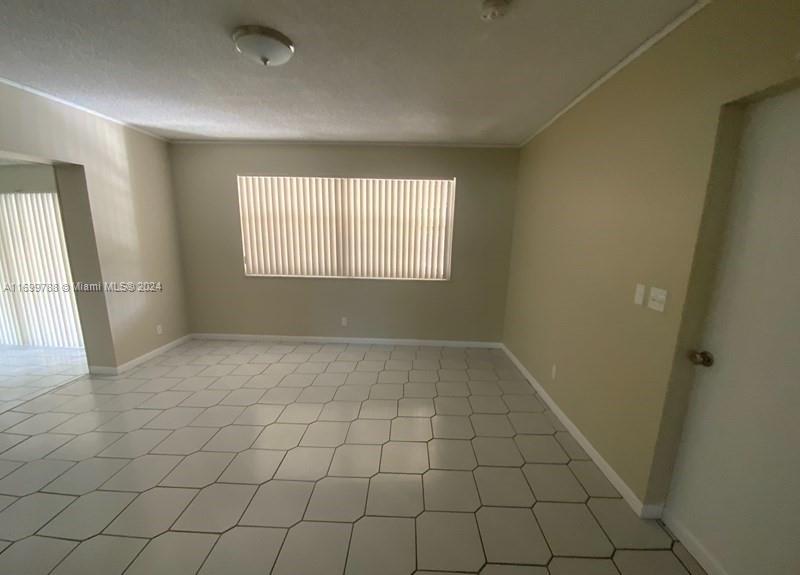 4308 Adams Street Hollywood, FL 33021 - Photo 9 of 21 an empty room with windows