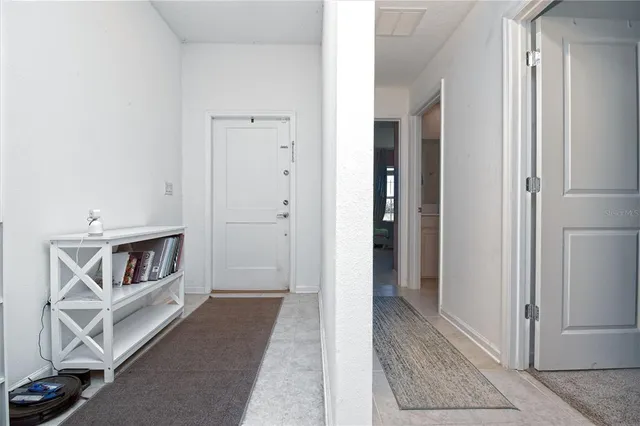 a view of an entryway and livingroom in right side