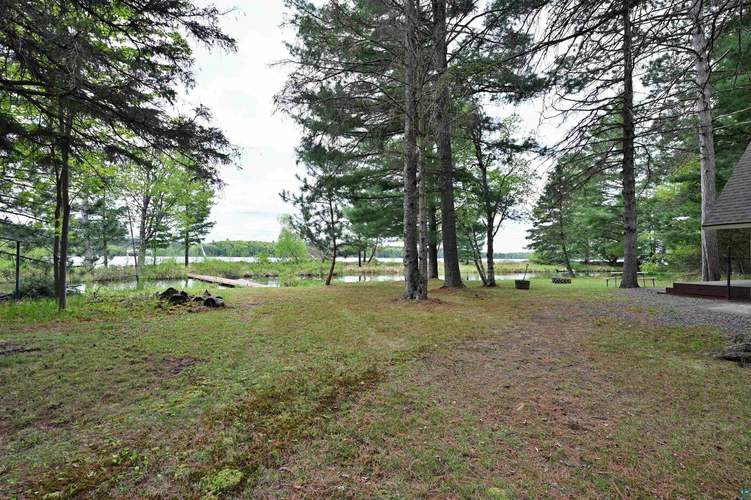 2775 Lake Road Barnes, WI 54873 - Photo 20 of 52 View of grassy yard with a water view
