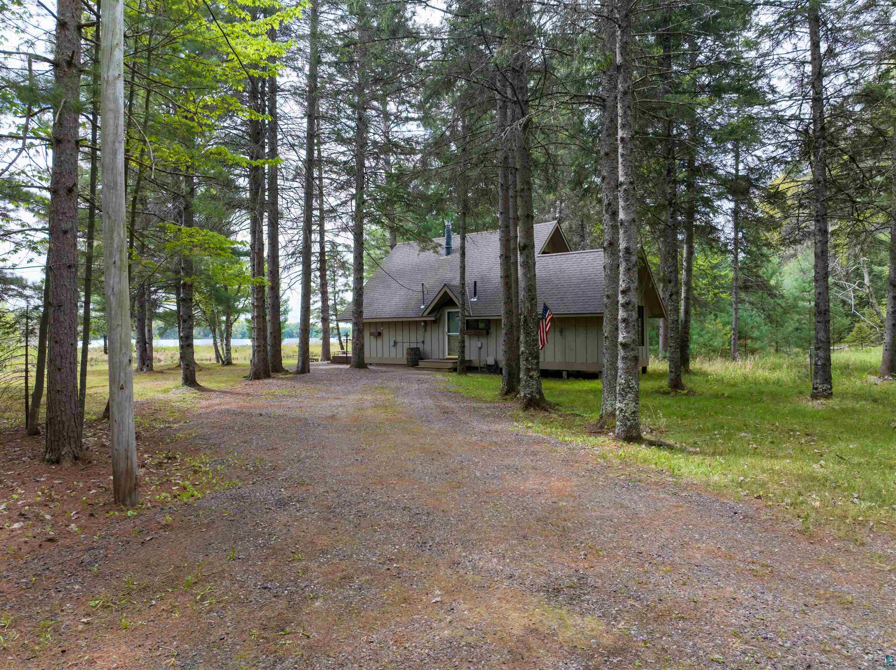 2775 Lake Road Barnes, WI 54873 - Photo 7 of 52 Chalet / cabin with driveway, a shingled roof, and board and batten siding