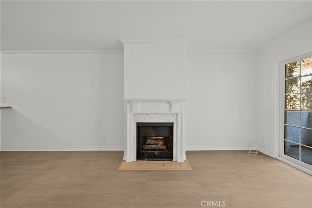 4401 Sepulveda Boulevard, Unit 107 Sherman Oaks, CA 91403 - Photo 14 of 25 a room with a fireplace