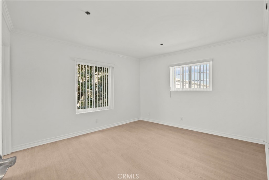 4401 Sepulveda Boulevard, Unit 107 Sherman Oaks, CA 91403 - Photo 15 of 25 an empty room with windows