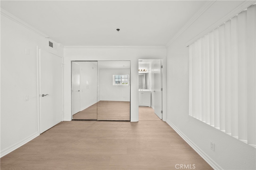 4401 Sepulveda Boulevard, Unit 107 Sherman Oaks, CA 91403 - Photo 17 of 25 a view of a hallway with wooden shelves