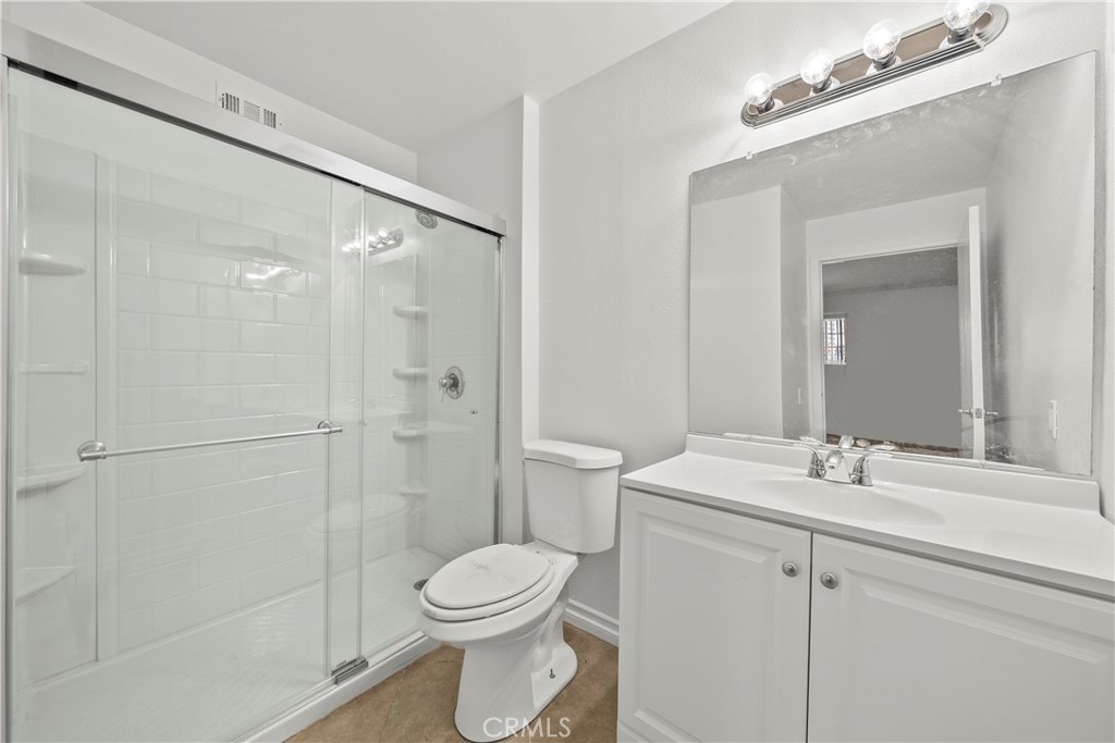4401 Sepulveda Boulevard, Unit 107 Sherman Oaks, CA 91403 - Photo 18 of 25 a bathroom with a sink a toilet and shower
